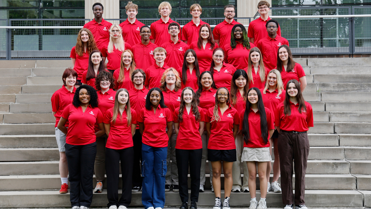 Group of Peer Leaders standing on steps with scarlet Ohio State tops