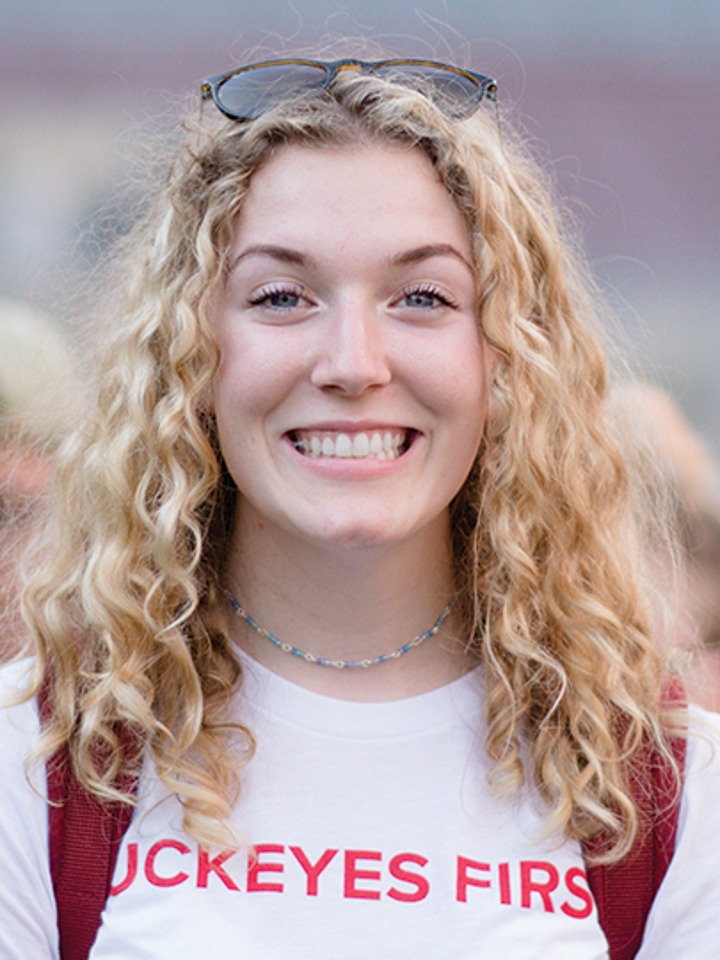 A female student celebrating Welcome Week in Ohio Stadium