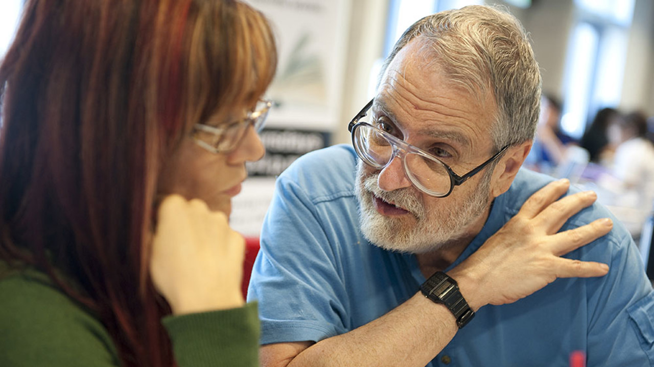 Faculty member helping a student