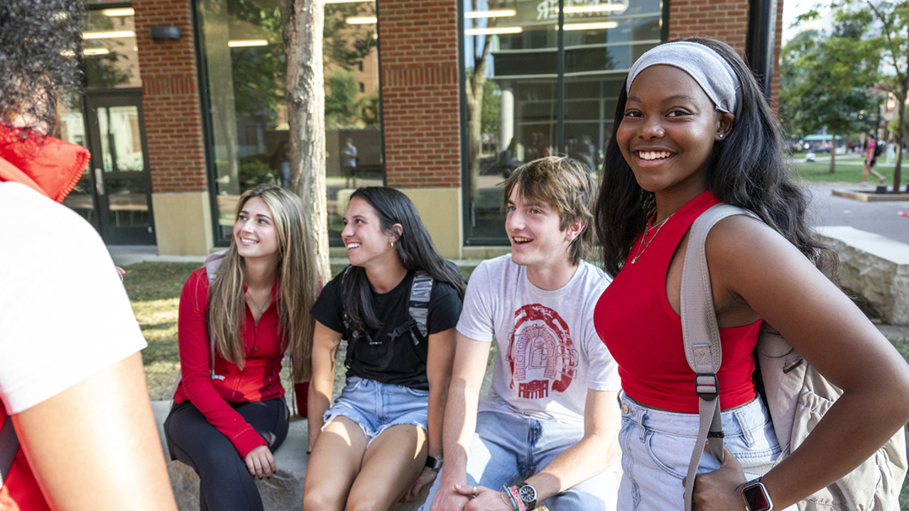Students talking outside of a residence hall