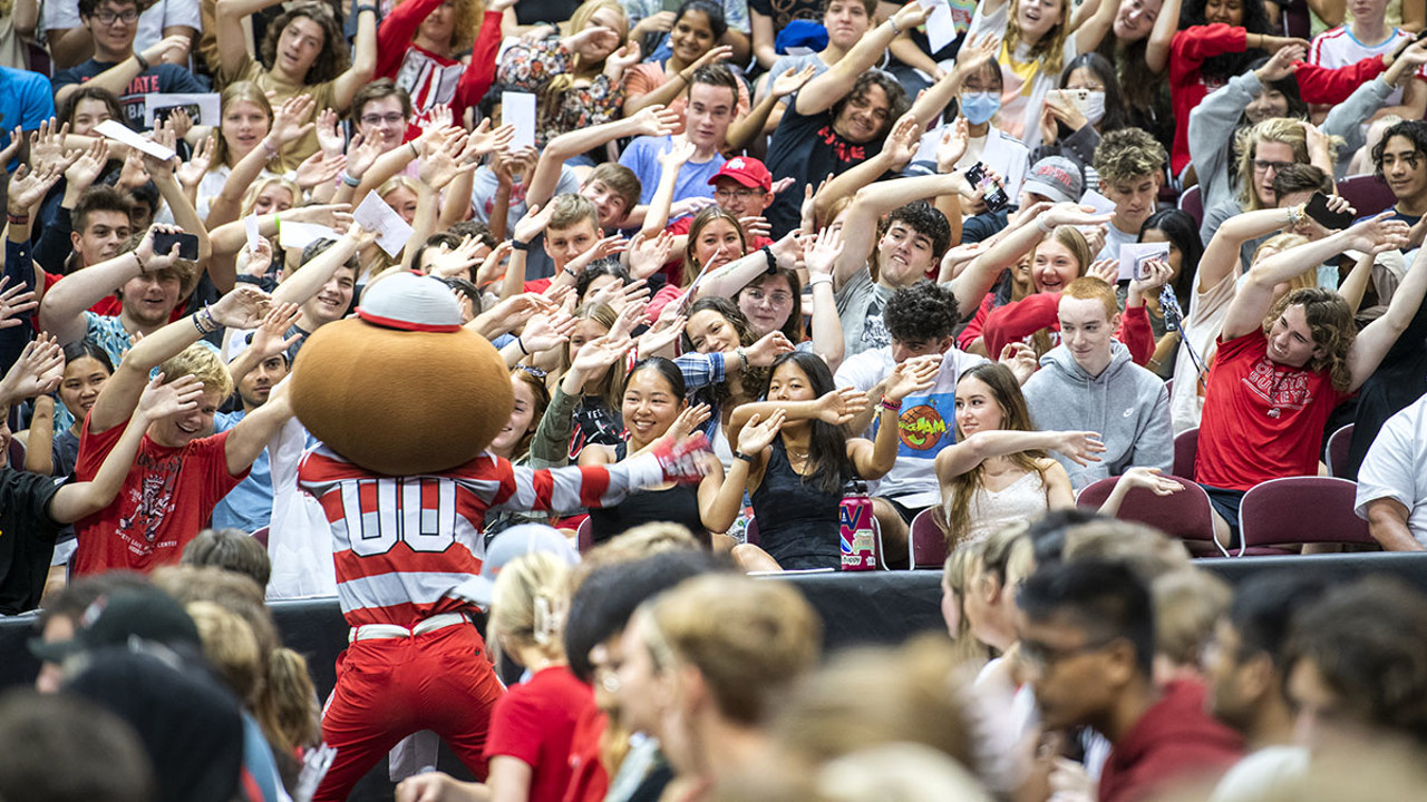 Students attend convocation at the Schottenstein Center with Brutus Buckeye