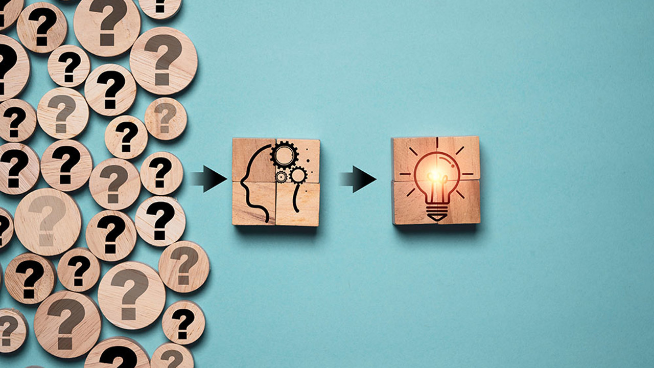 Questions marks going through a person and turning into a lightbulb.